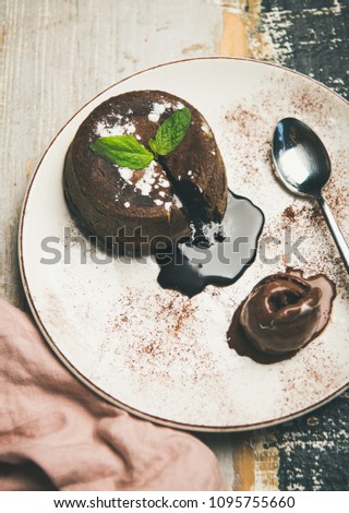 Hot chocolate souffle dessert cake with liquid filling and chocolate ice cream.