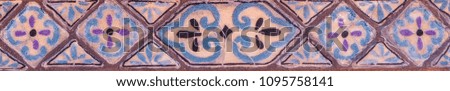 Traditional ornamental Spanish decorative tiles, original ceramic tiles on the walls of buildings, decoration