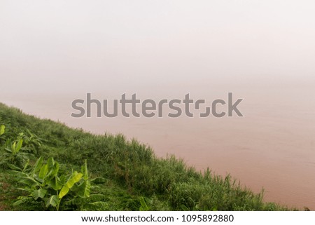 The Mekong River has a foggy down to see Laos. See the picture nearby. Even the river is invisible, but there is white fog. The image is white out of the mist.