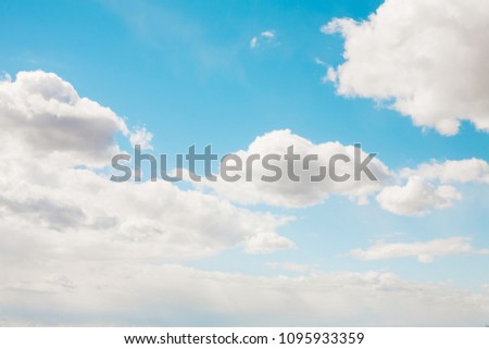 Blue sky with soft white clouds. Natural cloudscape background, texture for Design. Horizontal Wallpaper With Copy Space