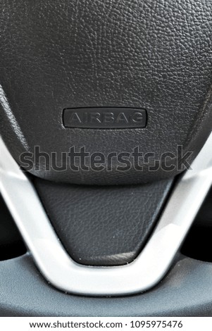 Wording"AIR BAG"with space on car steering wheel for illustration car safety concept