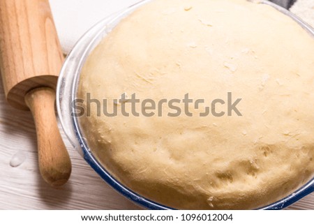 Yeast dough on wooden table
