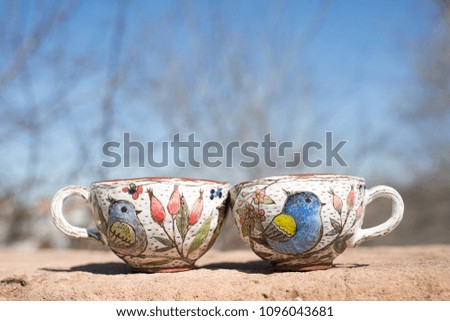 two clay cups handmade on the street