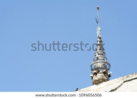 Traditional  Silver sculpture on roof with clear sky background