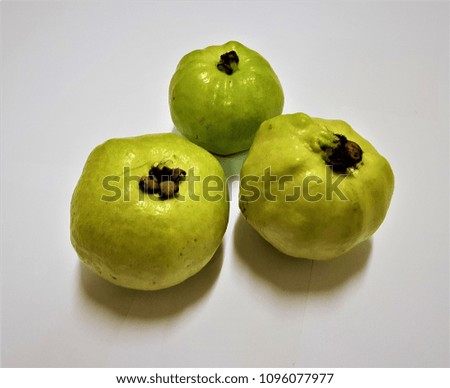 Green guava on a white ground.