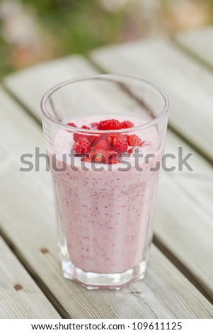Close-up of delicious strawberry smoothie with wild strawberries