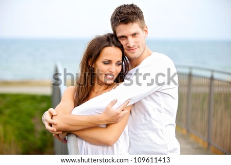 Portrait of a happy couple embracing while in the park