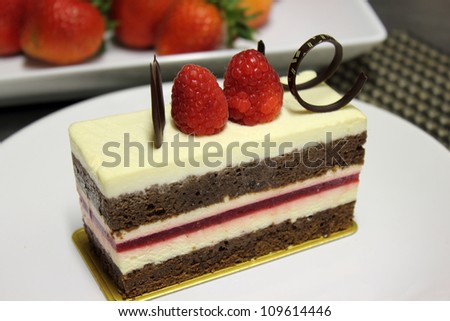 A white chocolate cake with fresh raspberry