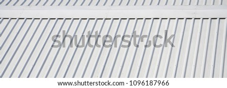 Metal gray roof with rhythmic parallel relief directions