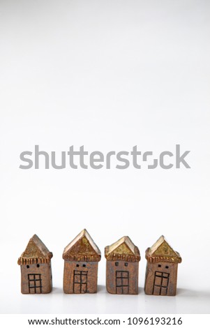 Brown Ceramic House Models on white for financial Concept.