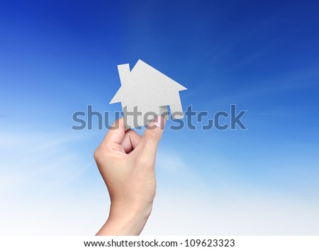 Hand hold a house paper