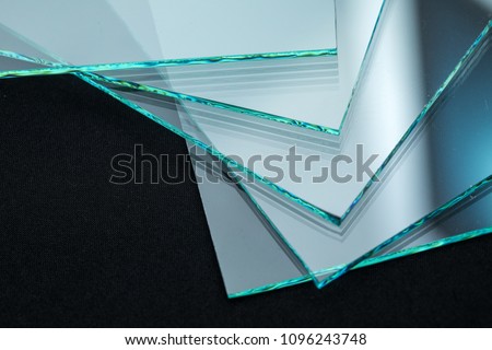 Sheets of Factory manufacturing tempered clear float glass panels cut to size Royalty-Free Stock Photo #1096243748