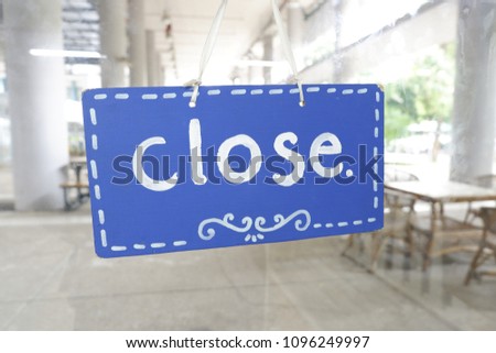Signage of Close  and blurred background.