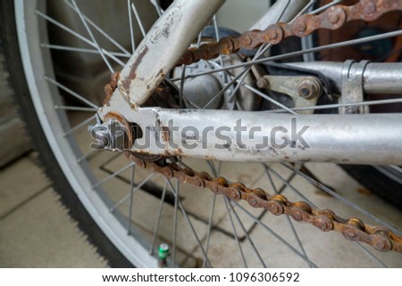 Closed up of rusty bicycle rear wheel, include Cog and chain