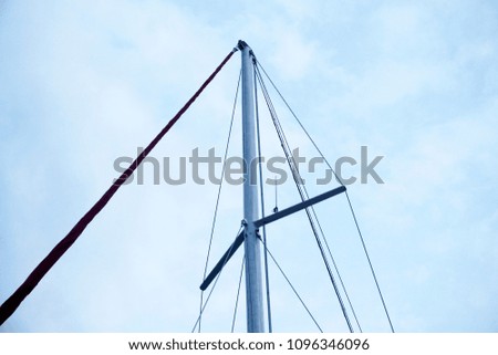  Mast of a white sailing yacht  against the blue sky, copy space                                                   