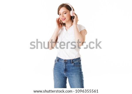 Portrait of beautiful lady in headphones listening music while dremily closing her eyes on white background isolated