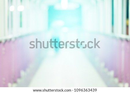 Blurred background of subway metro train railway station platform. People lifestyle in hurry urban city using mass transportation during rush hour to work and doing business