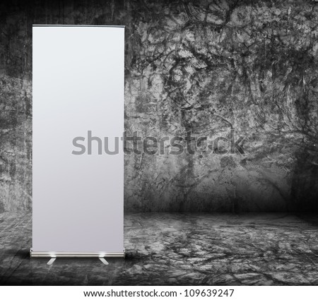 blank roll up banner display in Grungy concrete room