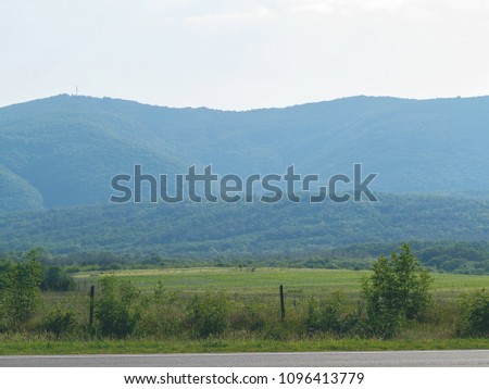 Beautiful landscape of the Caucasian mountains in a sunny spring day. Krasnodar Territory, Russia

