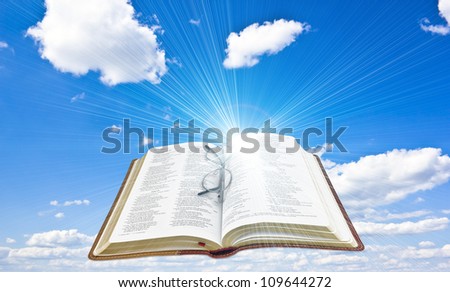 illustration of the opened Bible with sun rays