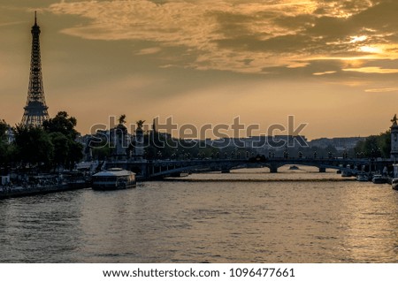 Seine River in Paris at sunset and in the background the Eiffel Tower in France