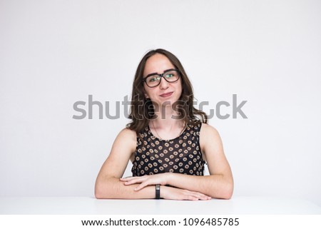 Tell me about your illnesses. Portrait of a beautiful brunette manager girl on a white background. She sits right in front of the camera smiling and looks happy