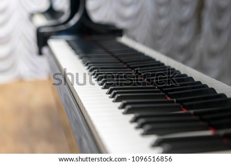 Piano keys close-up, selected focus. Close up view of black piano keys , selected focus .