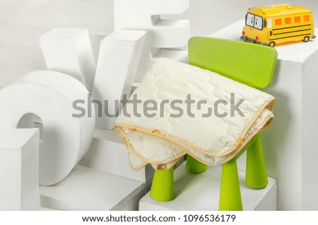 Blanket on green chair with Love decoration text abstract interior decoration