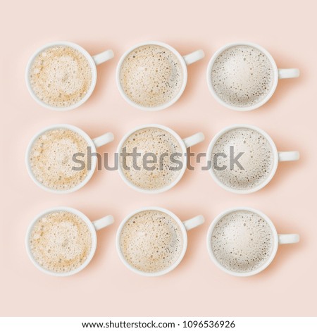 Set of Coffee cups assortment on pale pink background. Flat lay, top view collection