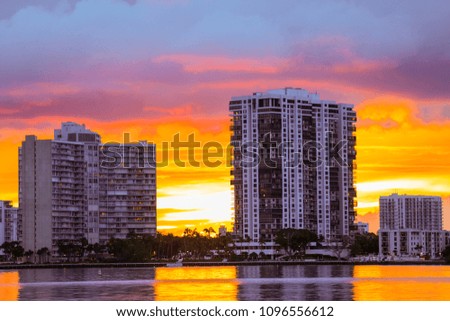 Lakefront buildings with a beautiful sunset in the background