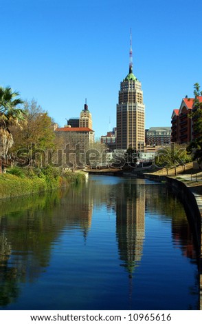 a riverwalk reflection of a tower in the San Antonio skyline