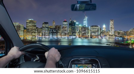 Driving a car towards Manhattan skyline at night, New York City, USA