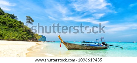Amazing view of beautiful beach with traditional thailand longtale boat. Location: Bamboo island, Krabi province, Thailand, Andaman Sea. Artistic picture. Beauty world.
