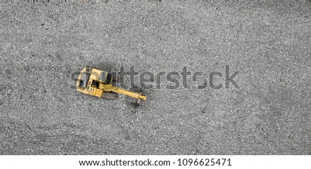 Top view of a yellow excavator