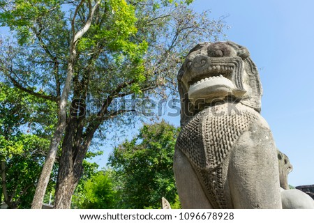 Lion sandstone statue in Phimai historical park. Prasat Hin Phimai Nakhon Ratchasima, Thailand. Royalty-Free Stock Photo #1096678928