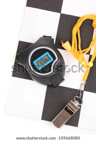 Checkered finish flag with whistle and stopwatch isolated on white