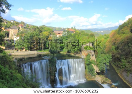 The Pliva Falls with historic walled town above it in Jajce, Bosnia and Herzegovina.