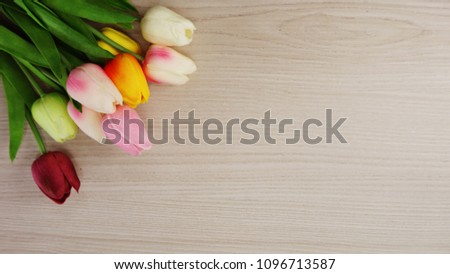 tulip flowers bouquet with space copy on wooden background
