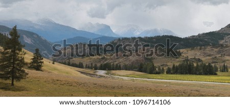 Cloudy weather in the mountains of Altai, mountain road, panoramic