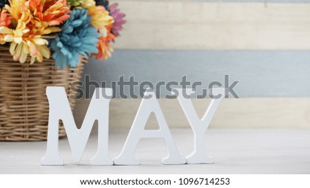 hello may alphabet letter with space and flower on wooden background