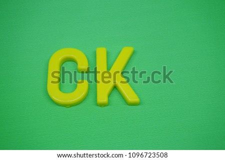 CK letters on green background