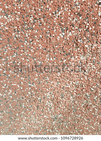 texture decorative plaster on the basis of small colored marble stones and acrylic adhesive composition, close-up abstract background.