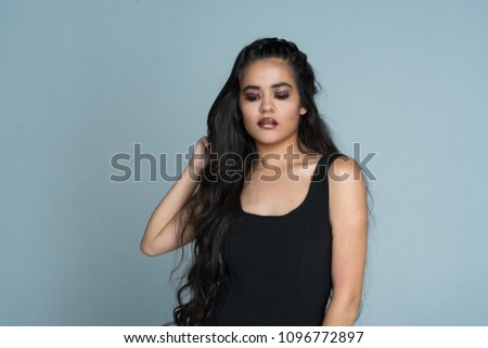 Hispanic teen girl modeling in a portrait session