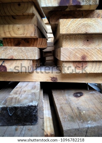 Blurry image and out of focus - Background and texture stack of pine wood timber material in construction site