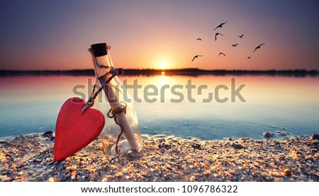 love letter - romantic bottle with a message at the beach Royalty-Free Stock Photo #1096786322