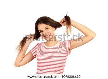 Girl confused with her hair. emotional girl isolated on white background.
