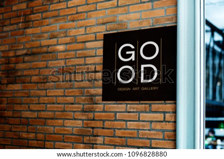 Square black sign on a brick wall mockup