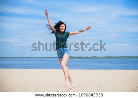 Woman Jumping on the Beach Having Fun, Summer vacation holiday Lifestyle. Happy women jumping freedom on white sand.