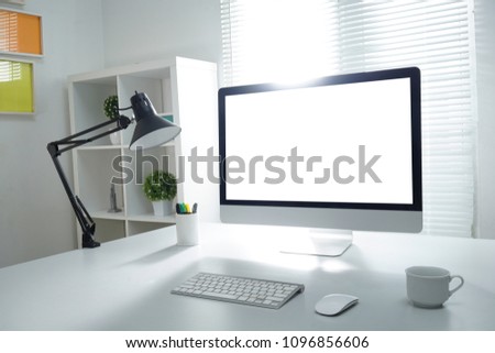 Mock up PC with white screen and window light background Royalty-Free Stock Photo #1096856606
