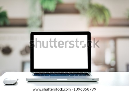 Conceptual workspace,Empty space white desk on Laptop screen and wireless mouse,Interior office blurred background of light bokeh.